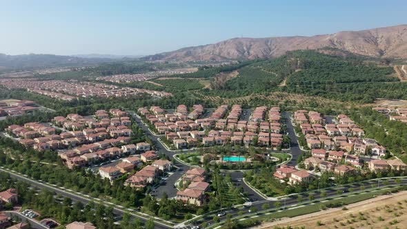 Aerial view showing luxury Orchard Vista Park with many villas during sunny day in Irvine,California