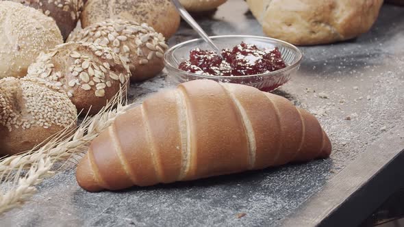 Closeup of Different Types of Fresh Baked Dutch Bread is on the Wooden Table