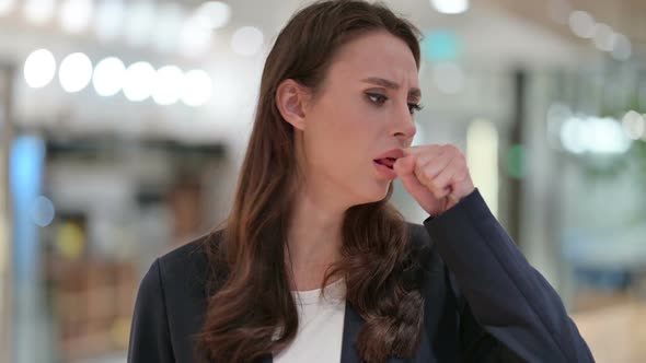 Portrait of Allergic Young Businesswoman Coughing Cough