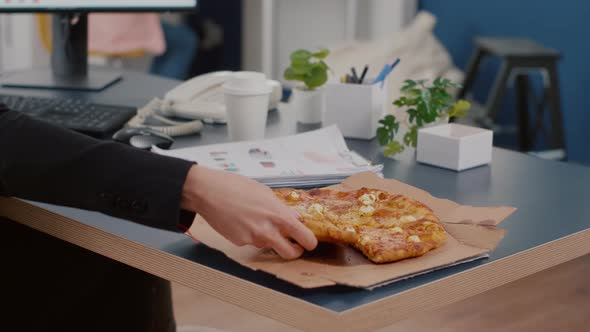 Closeup of Executive Manager Taking Slice of Pizza Eating in Front of Computer Typing Financial