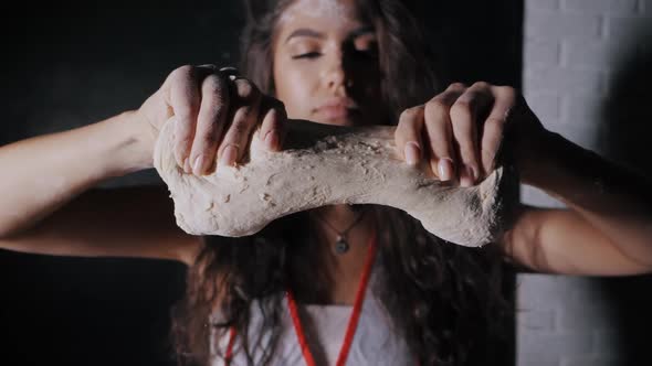 Female Hands Gently Knead the Dough Closeup in Slow Motion
