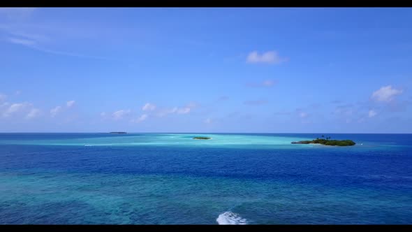 Aerial view abstract of relaxing seashore beach trip by blue lagoon with white sandy background of a