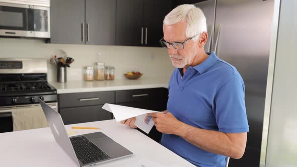 Mature man having a video meeting while working from home