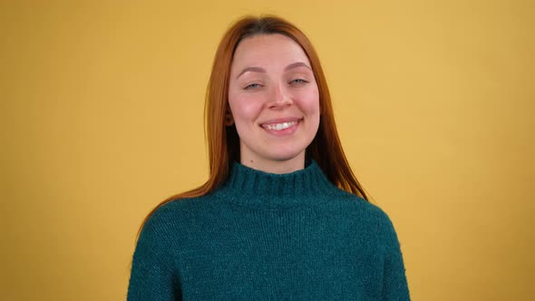 Young Red Hair Woman Posing Isolated on Yellow Color Background Studio