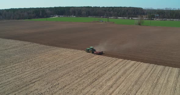 Tractor Working in Field at Springtime Aerial View