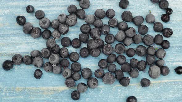 Timelapse Footage of Freezing Fruits, Berries on Blue Surface. Frozen Food. Frosting of Blueberry