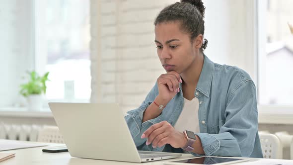 Pensive Young African Woman Working on Laptop, Thinking