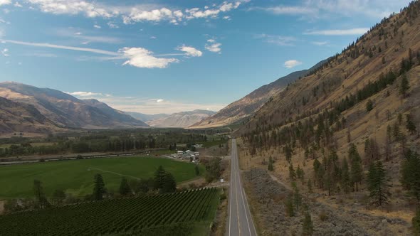 Aerial View of Scenic Road, Hwy 3, in the valley around the Canadian Mountain Landscape. Near Osoyoo