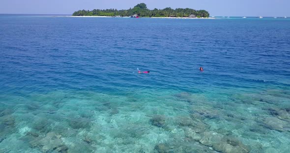 Wide angle fly over abstract shot of a summer white paradise sand beach and turquoise sea background