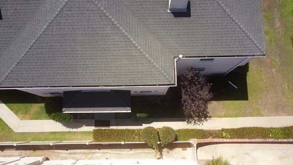 Aerial drone shot flying above and away from a house in a spiral motion. University Heights, San Die