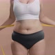 Overweight Woman in Underwear Measuring Her Fat Belly with Measure Tape - VideoHive Item for Sale