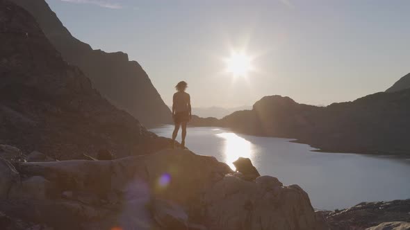 Adventurous Caucasian Adult Woman Hiking on Top of a Canadian Rocky Mountain