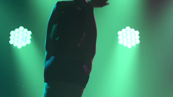 A Modern Dancer in Black Lingerie Performs Plastic Beautiful Dramatic Dances in a Dark Studio with