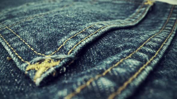 Extreme Detailed of Blue Denim Jeans Texture in Dolly Shot Over Cloth Surface