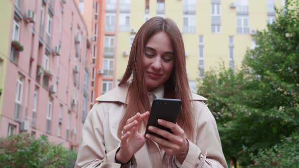 Female Tourist in the City with Mobile Phone