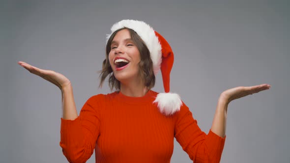 Woman in Santa Helper Hat Dancing on Christmas