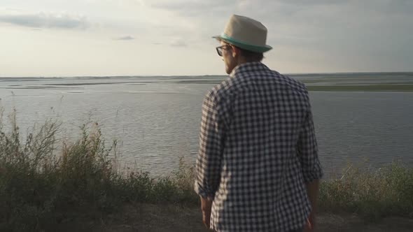 Handsome Man Looks at the River