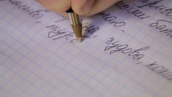 Woman signing signature with a ballpoint pen