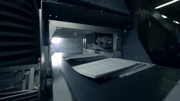 Conveyor Is Relocating Sheets of Printed Paper