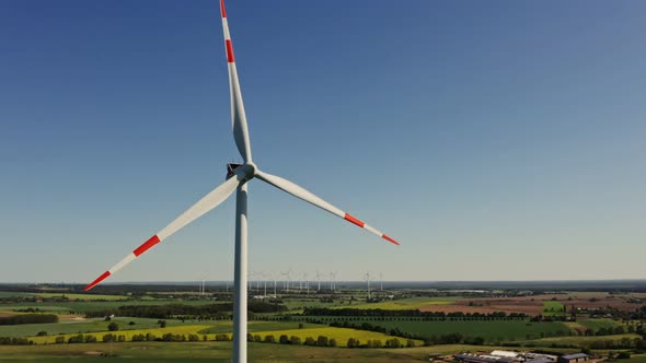 A Drone Shot of a Massive Wind Farm in Agricultural Land