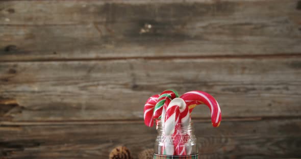 Pine cones and candy cane arranged in a jar 4k