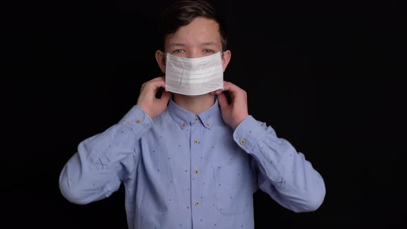Boy Puts Up Protective Mask From Viruses