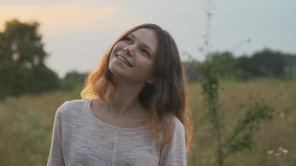 Smiling Girl 15 Years Old, with Brown Flying Hair