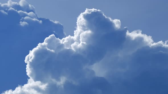 Fluffy cloud time lapse on a cloudy day 4k footage.