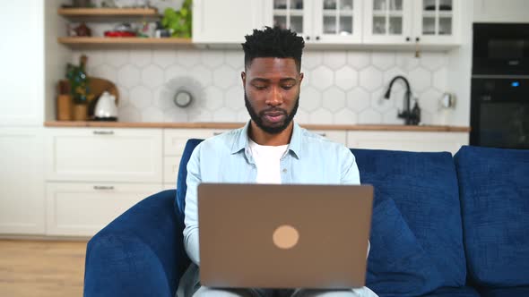 Excited Guy Looking at Laptop Screen and Screaming with Joy Received Mail Good News