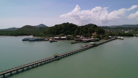 Laem Hin Pier in phuket thailand surrounded by turquoise blue andaman sea on a sunny day
