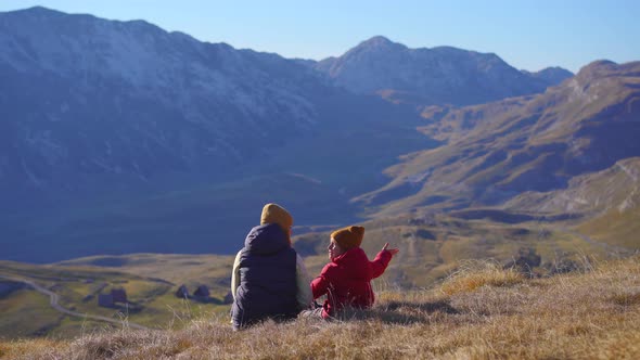 Family of Tourists Visits the Sedlo Pass Bobov Kuk in the Mountains of the Northern Montenegro