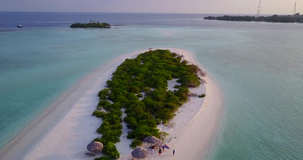 Luxury aerial copy space shot of a white paradise beach and blue sea background in colorful 4K