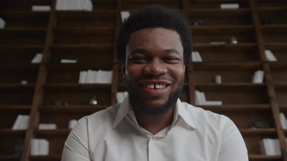 POV Shot of a Young Adult Man Greeting and Laughing During a Video Conference Call