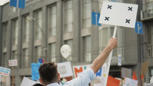 Man at Political Meeting with Banner with Points for Tracking To Copy Space Text