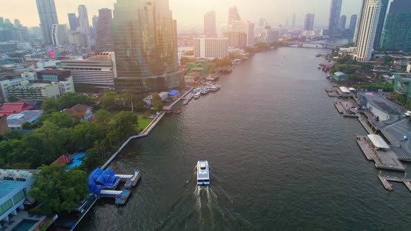 4K UHD : Drones fly over passenger boats moving on the Chao Phraya River