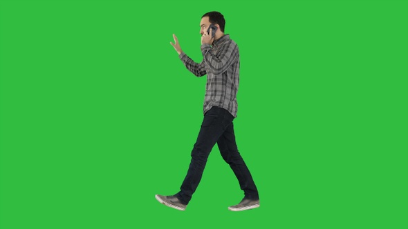 Man talking on phone walking and making gestures