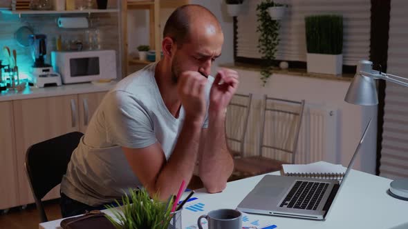 Concentrated Man with Headache Trying To Finish the Project