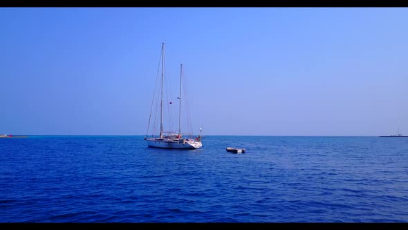 Aerial landscape of tropical sea view beach trip by turquoise lagoon with white sandy background of 