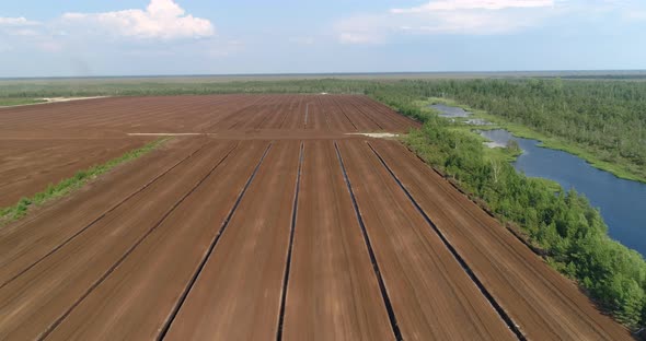Peat Harvesting Field and Green Nature Natural Bog Landscape Aerial View