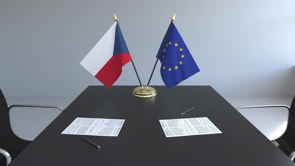 Flags of the Czech Republic and the EU on the Table