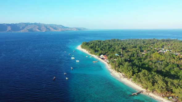 Aerial flying over travel of paradise coast beach lifestyle by clear lagoon and white sandy backgrou