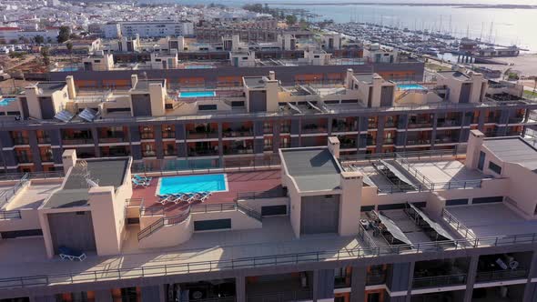 Aerial View of the Urban Area of Portugal in the South of Houses with Modern Infrastructure Swimming