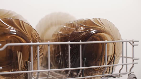 Plates Clean by Spraying Water in Dishwasher Machine