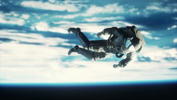 Astronaut Floating Above the Earth Elements of This Image Furnished By NASA