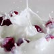 Several Halves of the Cherry Berries Fall Into the Milk - VideoHive Item for Sale