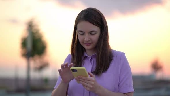 Happy Business Woman Enjoy Success Looking in Mobile Phone in Sunset Background