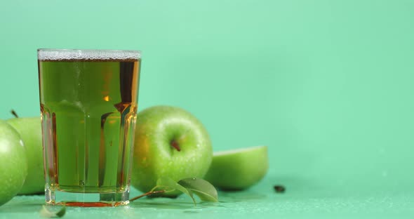 Rotating Fresh Apple Juice in the Glass