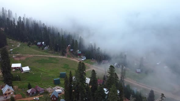 Misty Aerial View Of High Mountain Village