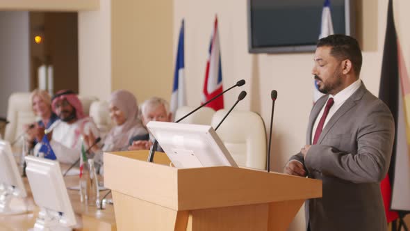 Political Leader Making Speech on Tribune at Press Conference