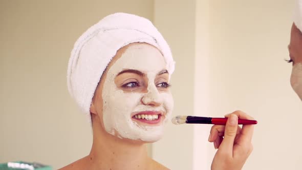 Beautiful Woman Having a Facial Treatment at Spa